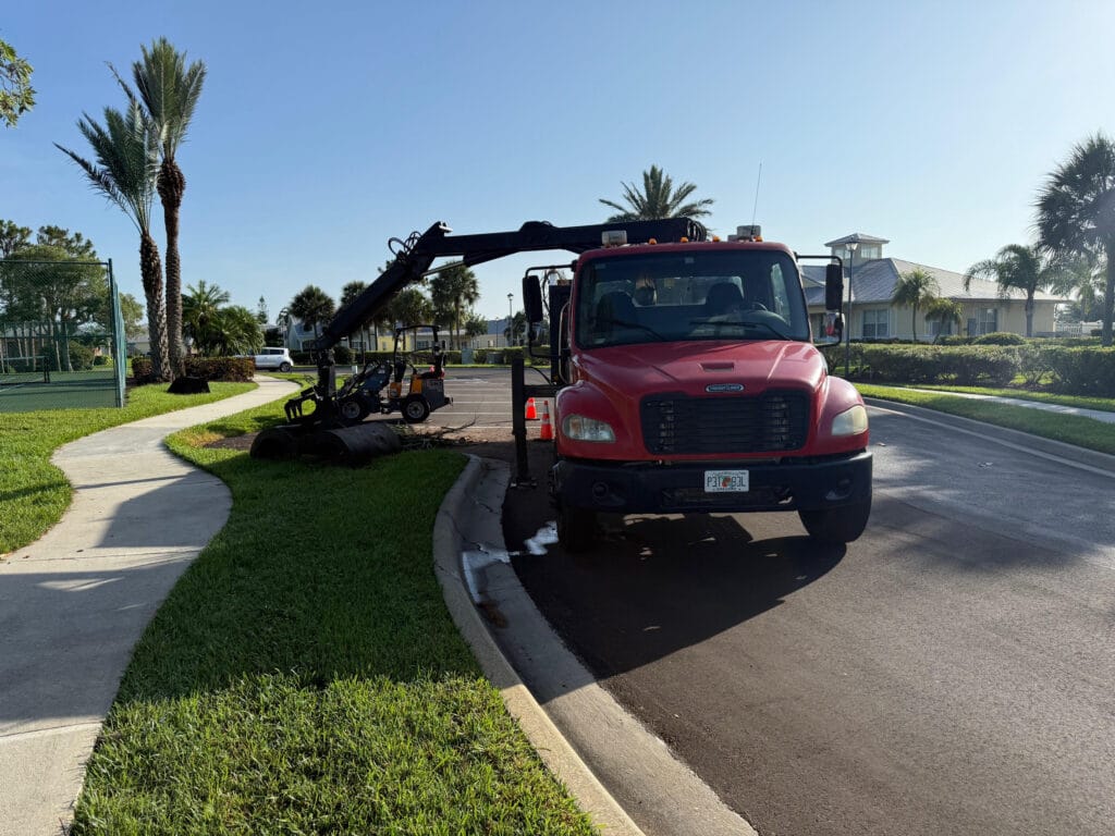 TR grapple truck loading limbs and debris